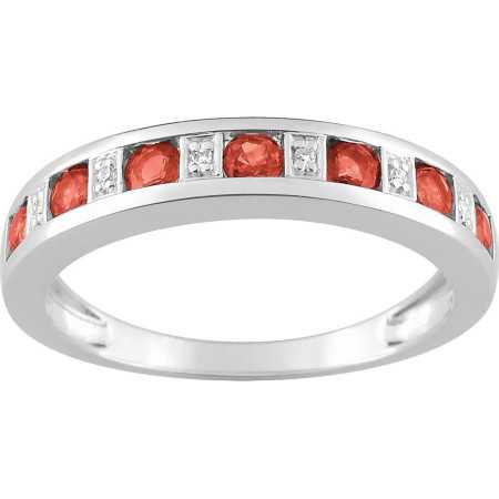 Bague en or blanc 750/1000 avec 7 rubis et diamants